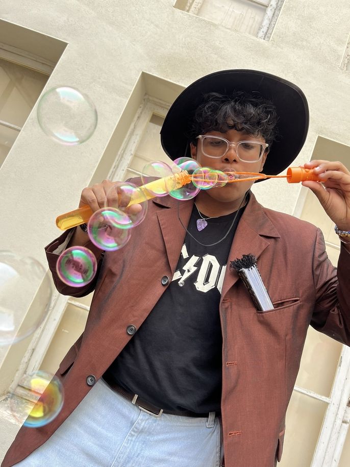 student blowing bubbles