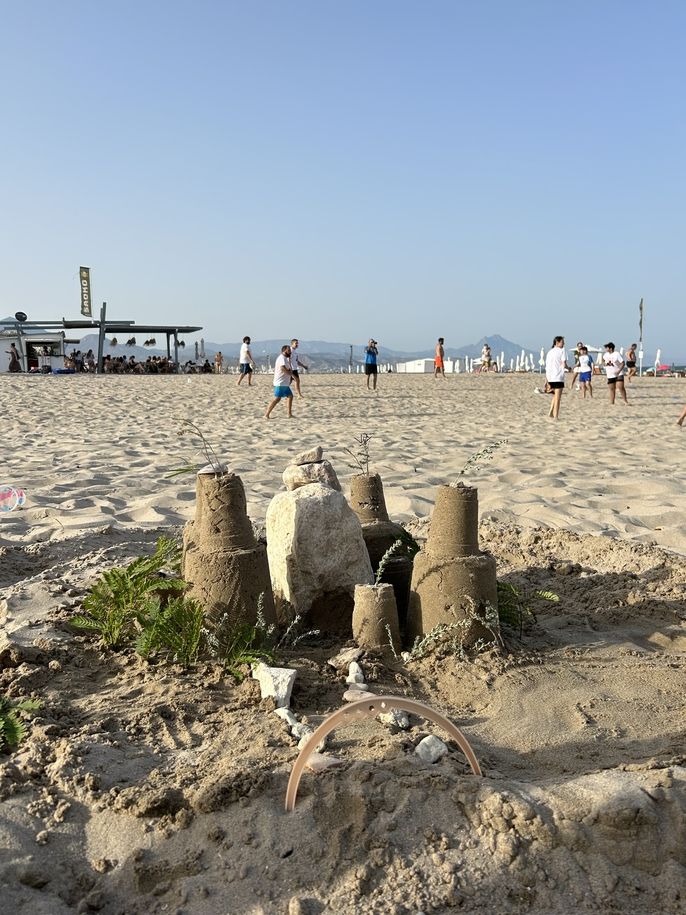 The winning sandcastle! Complete with a forest and use of the surrounding natural materials.