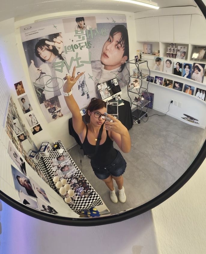 Peace sign pose in mirror picture in Jungkook birthday cafe