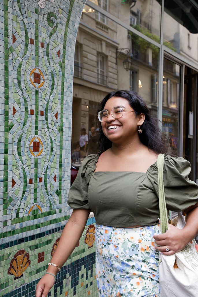 student-cheerfully-walking-down-the-street-in-paris.jpg