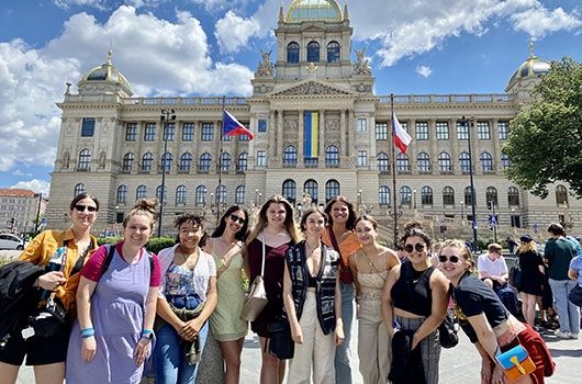 famous building in prague city center with students