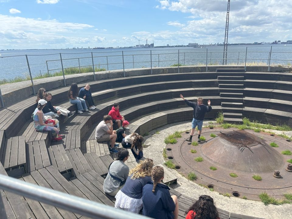 Tour guide David standing in the amphitheatre, discussing its use for public forums.