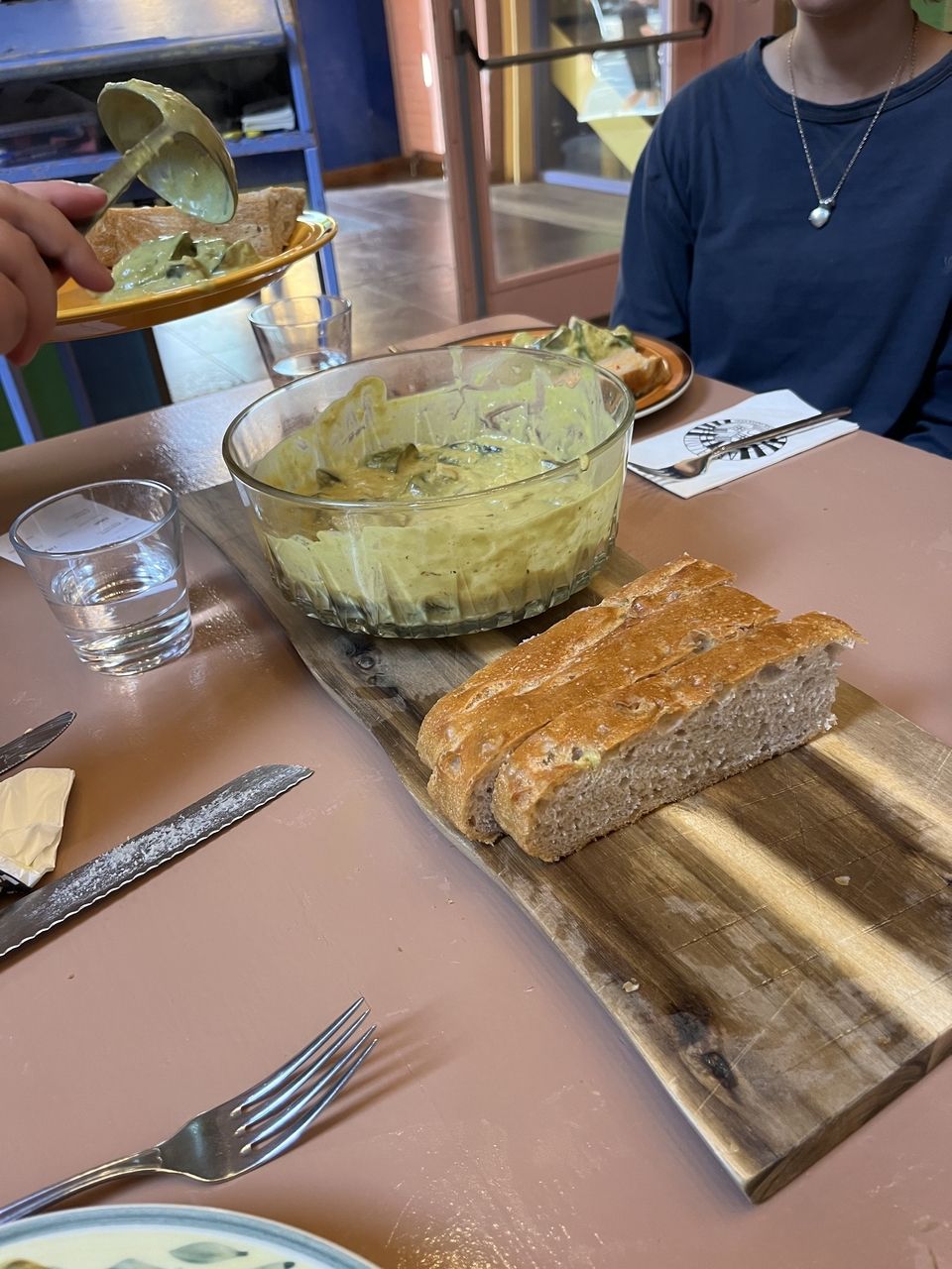 Vegetables in green curry with focaccia.